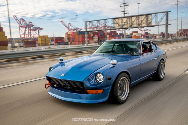 An image of a Blue Datson 24z Fairlady speeding down the road