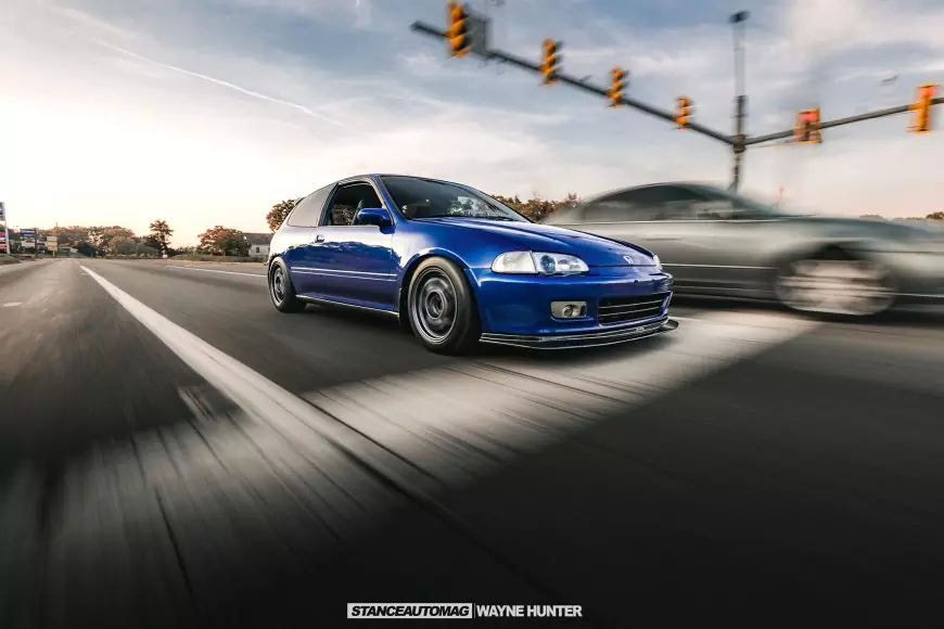Honda Civic speeding down the road shot by stance auto magazine