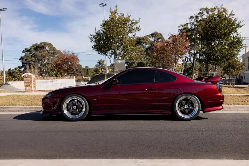 A nissan 200sx in red parked on the street in Australia