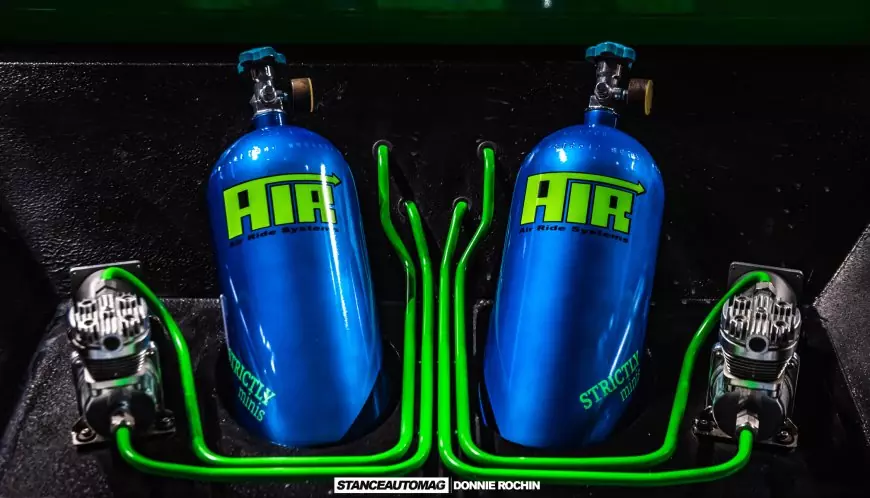 Air suspension tanks in the boot of a modified car featured on stance auto magazine