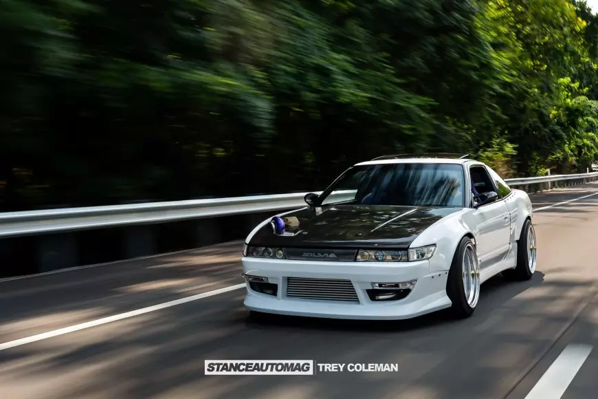 1991 Nissan 240SX shot by Stance Auto Magazine Photographers driving down the road