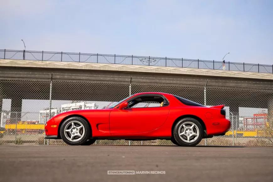 Side shot of a red 1995 Mazda RX7 FD shot by Stance Auto Magazine Photographers