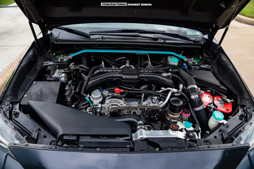 The engine bay of a 2015 Subaru WRX featured on Stance Auto Magazine