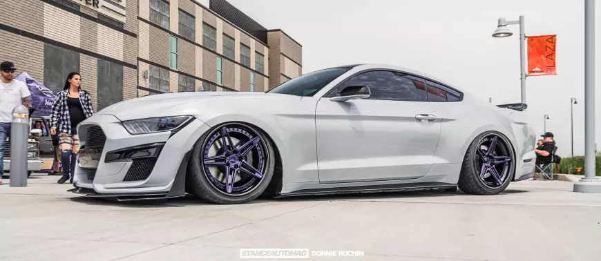 Picture of a white mustang GT lowered to the ground on airsuspnsion, shot by stance auto magazine photographers