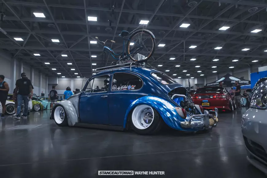 Picture of a stanced VW Beetle, blue with white wheels shot by stance auto magazine photographers