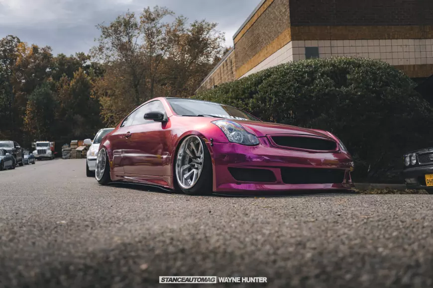 Picture of a pink car whith chrome wheel s stanced, shot by stance auto magazine photographers