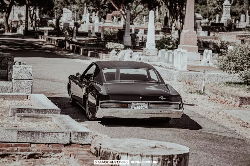 The rear of a lowrider 1967 Buick Riviera 'Deathwish'  shot by stance auto magazine photogrpahers