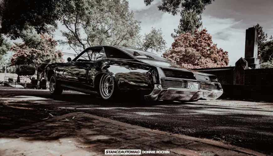 A shot of a lowrider 1967 Buick Riviera 'Deathwish'  shot by stance auto magazine photogrpahers