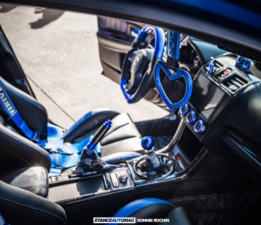 Some cool extra accents in the interior of a Blue 2015 Subaru STI Launch Edition shot by stance auto magazine photographers