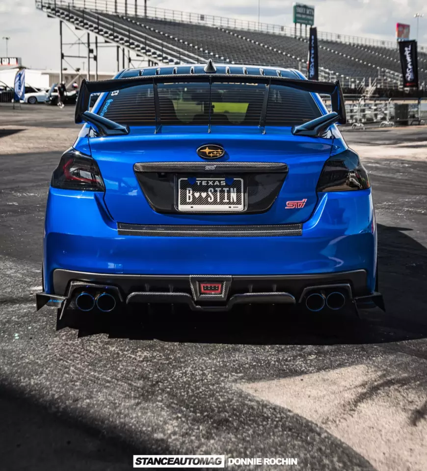The rear view of a Blue 2015 Subaru STI Launch Edition shot by stance auto magazine photographers