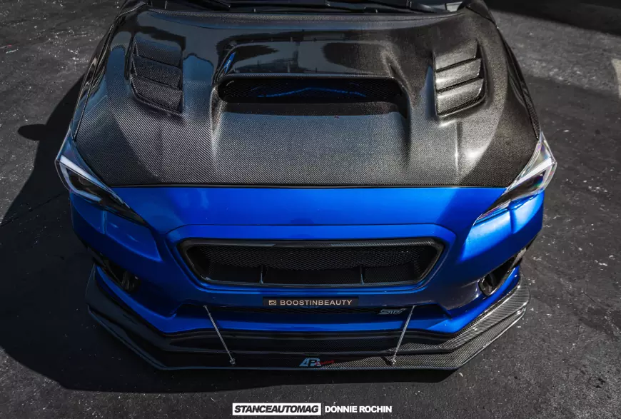 The carbon fibre bonnet on a modified a Blue 2015 Subaru STI Launch Edition shot by stance auto magazine photographers