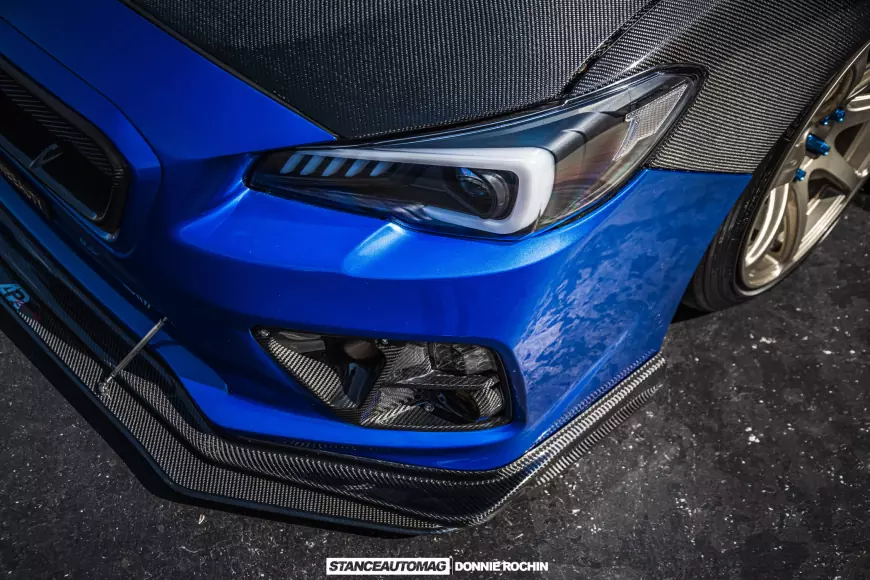 The head lights on a Blue 2015 Subaru STI Launch Edition shot by stance auto magazine photographers