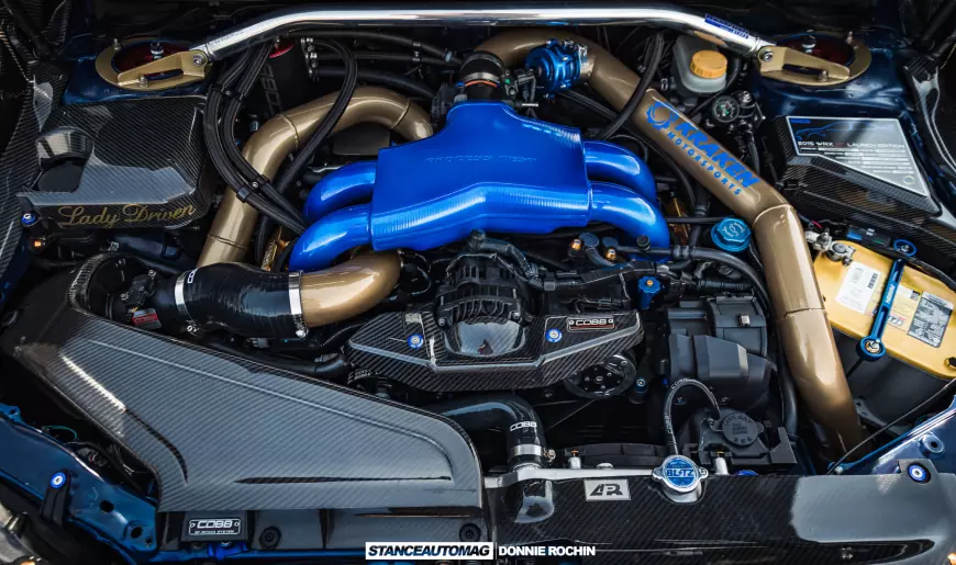 The engine and engine bay of a Blue 2015 Subaru STI Launch Edition shot by stance auto magazine photographers