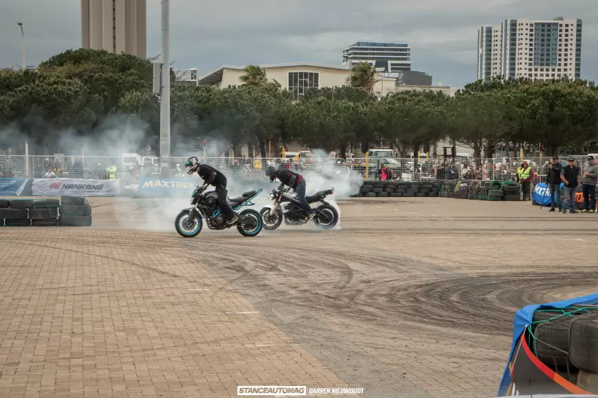 Motor cyle stunt riders doing burnouts