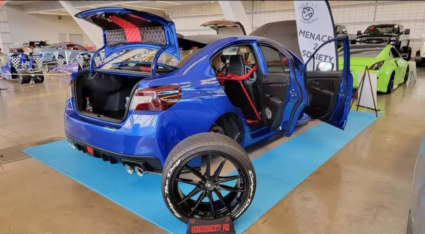2020 Bagged Subaru Wrx on display with its wheels of and doors open