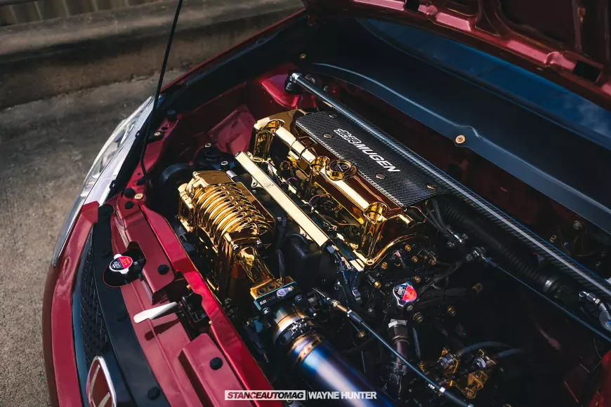 A golden engine on a civic si