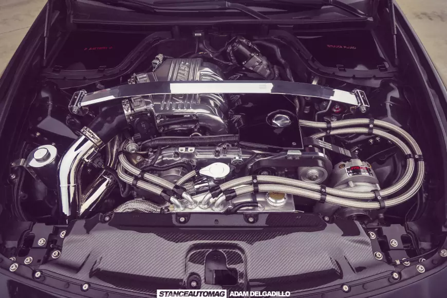 The engine of a 2012 Infiniti G37 with its stillon supercharger