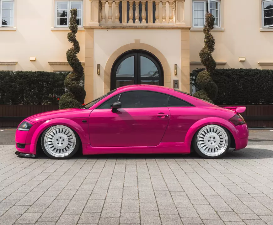 Pink 2001 Audi TT with silver wheels 