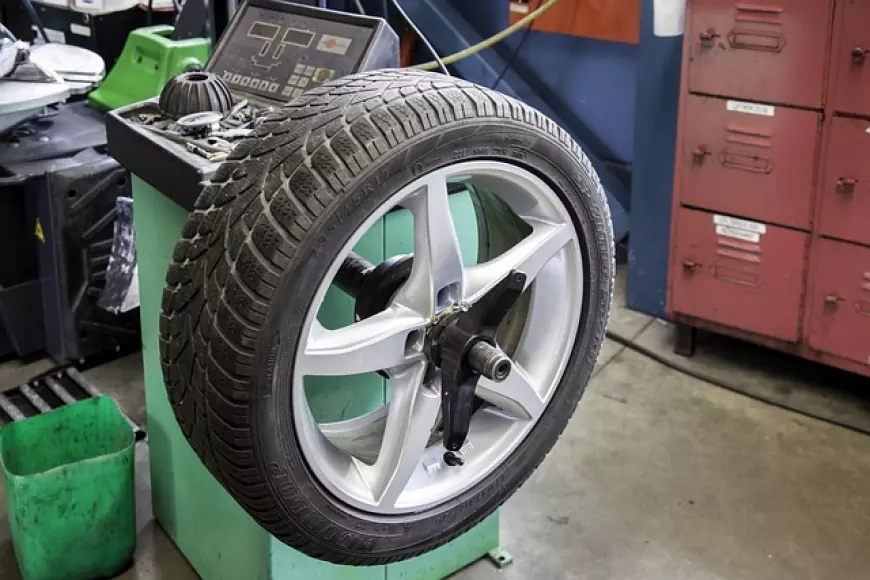 A wheel on a car tyre balancer