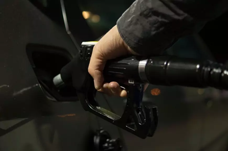 Picture of a Fuel Hose filling a car with fuel