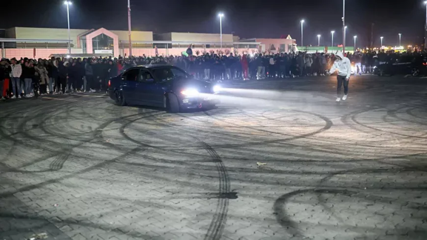 illegal takeover at a car event cars racing up the streets