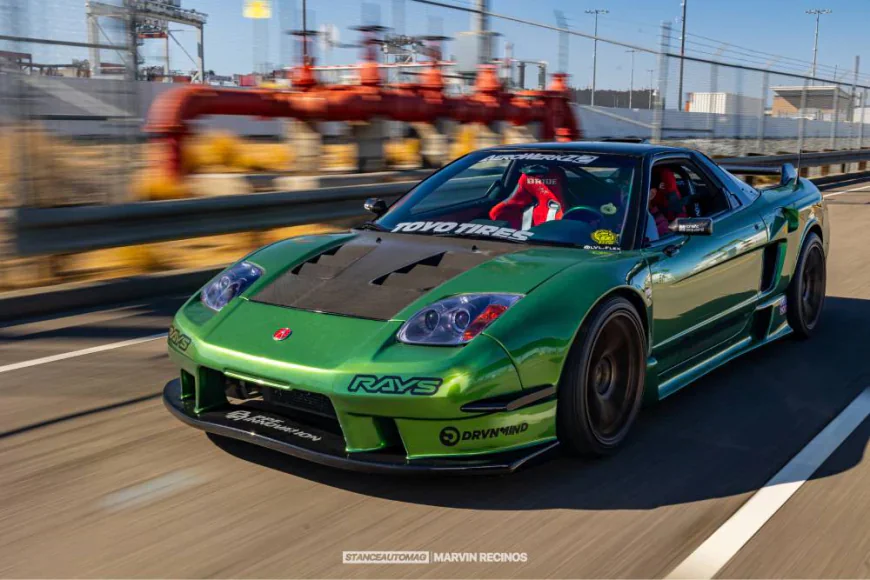 acura nsx in green speeding down the highway