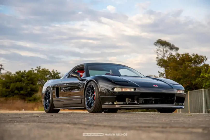 black nsx parked in the sunshine