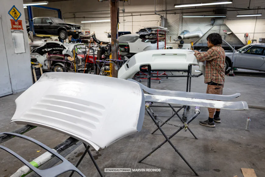 Akira Nakai working on a rear bumper