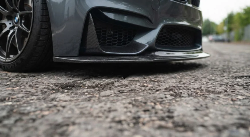 Front splitter fitted to a lowered car, showing the gap between the leading edge of the splitter and the road surface