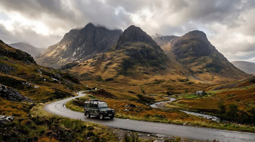 Land Rover Defender parked on an off-road trail, showing the capability that makes Land Rover hire so popular